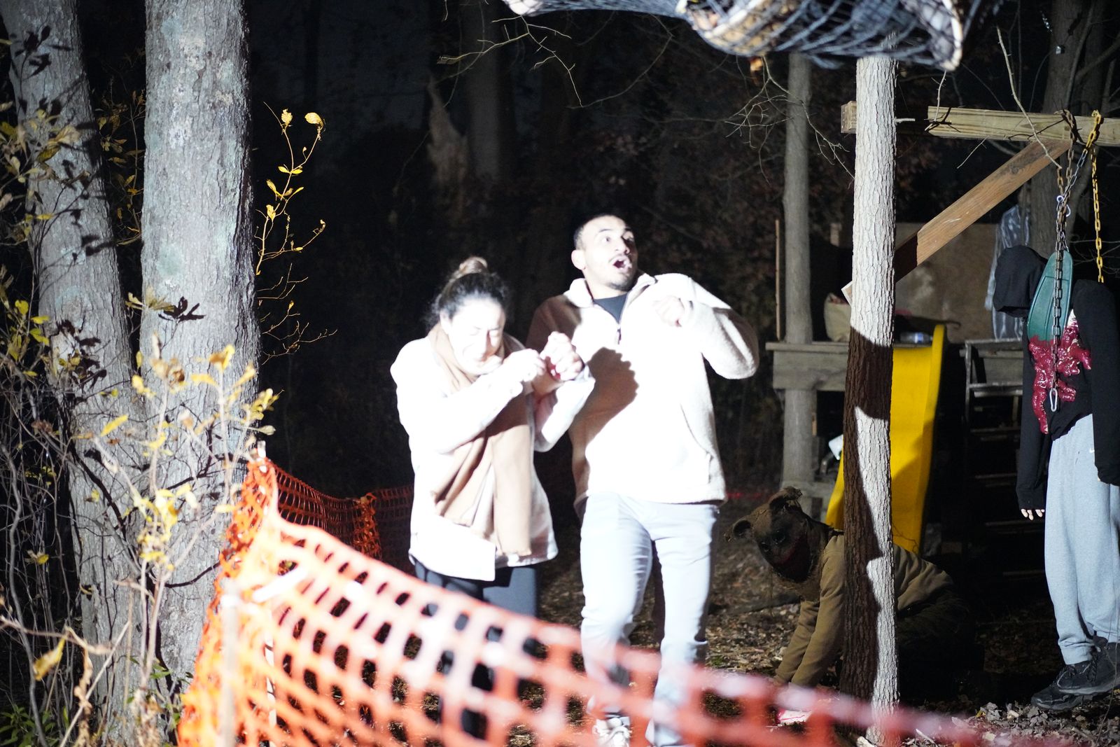 A couple recoiling as they round a corner of the trail